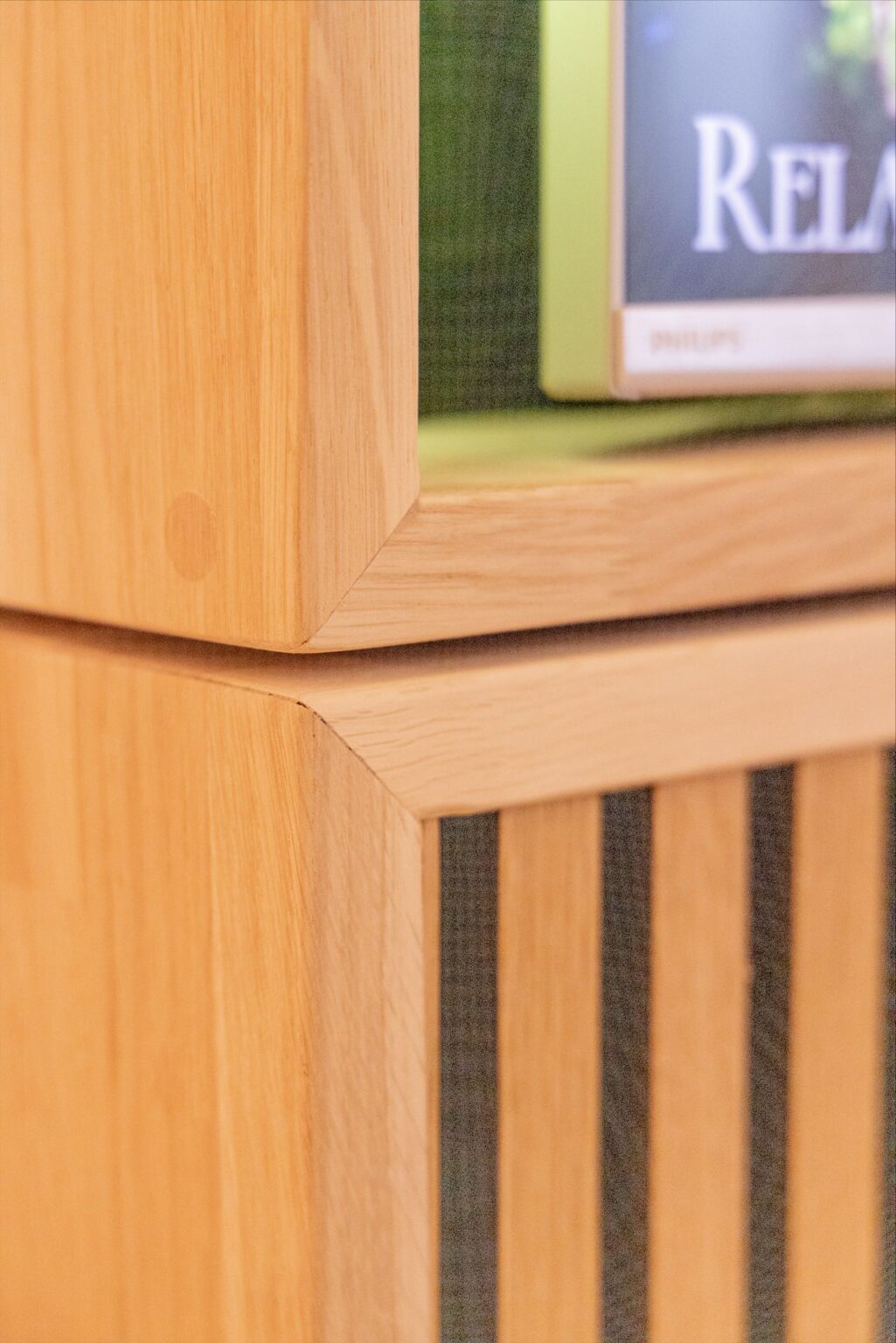 Wooden furniture detail with blurred background.